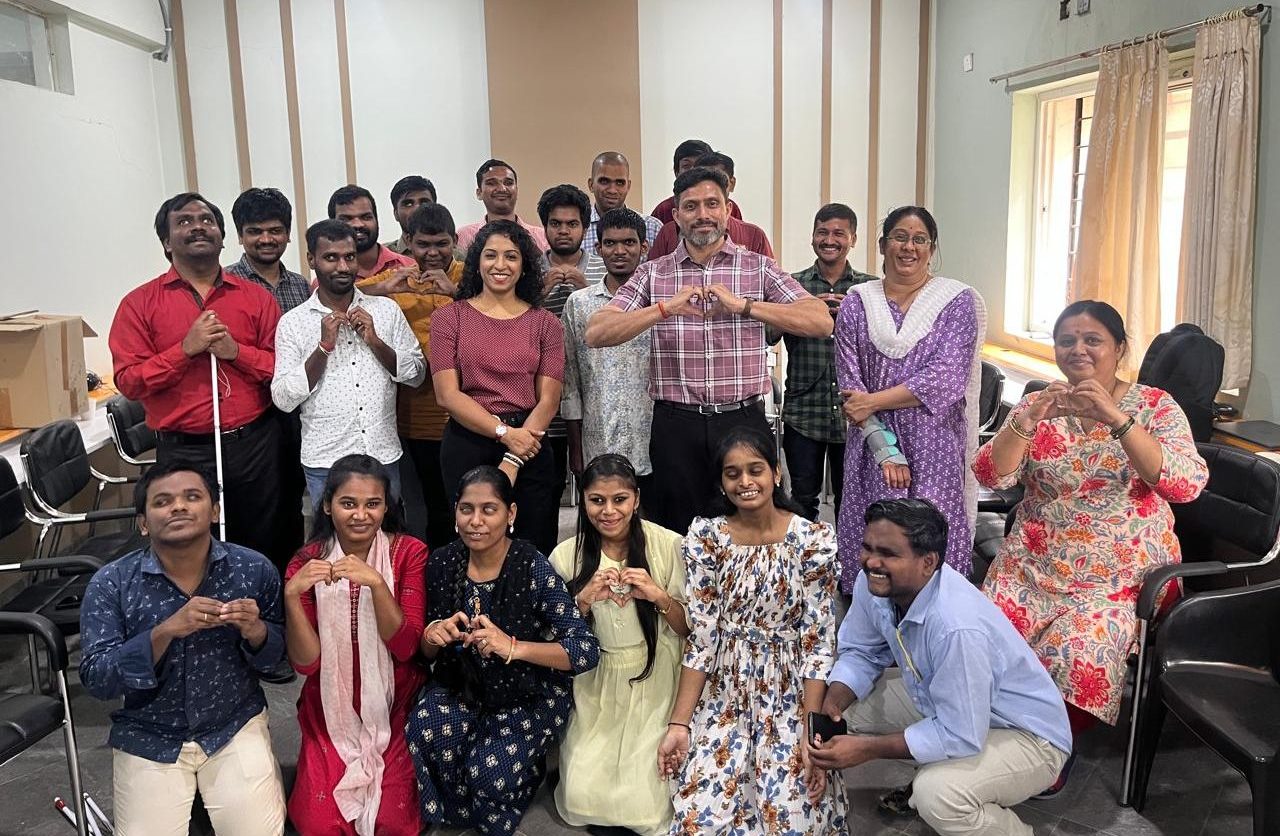 Group Photo of wellbeing coaches Jitesh and Lavanya with visually impaired Trainess