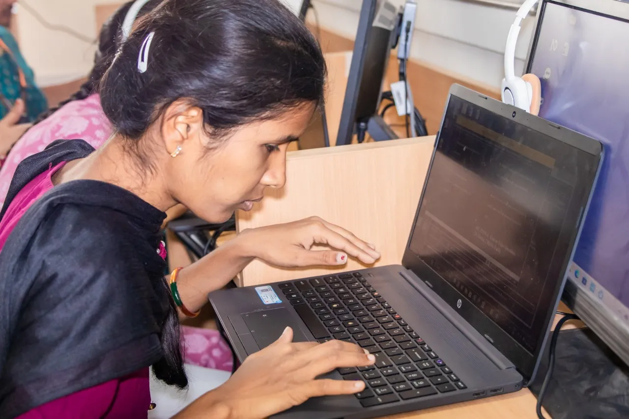 A Visually impaired student working on the Laptop.